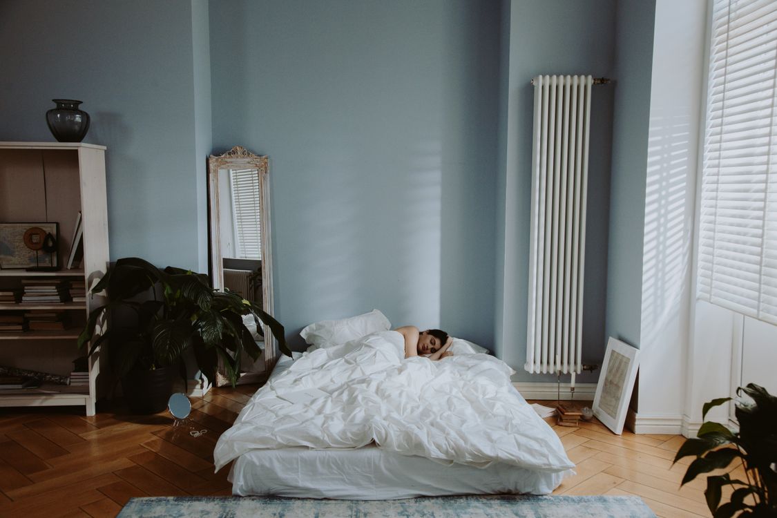 Person sleeping in a quiet bedroom